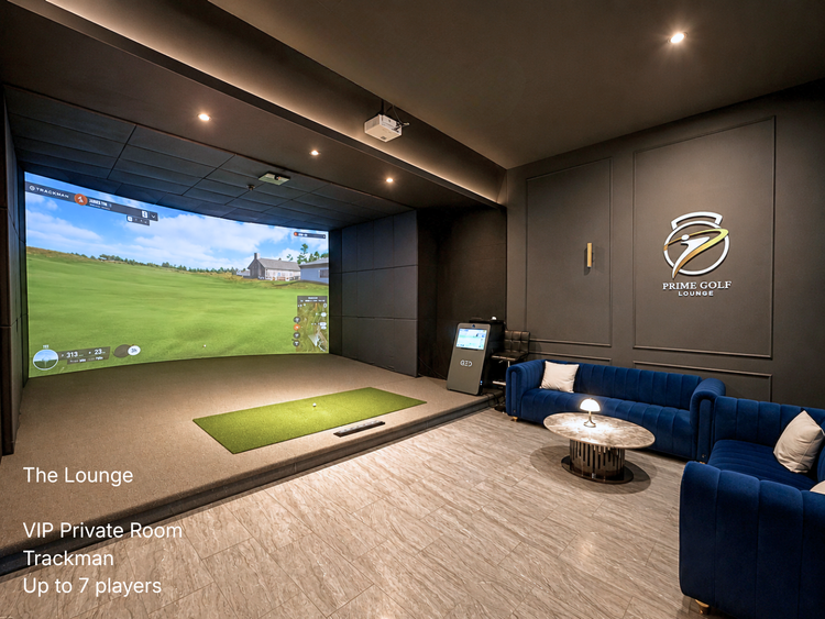 Commercial golf lounge featuring royal blue velvet seating, acoustic baffles, and Trackman simulator bay at Prime Golf Lounge