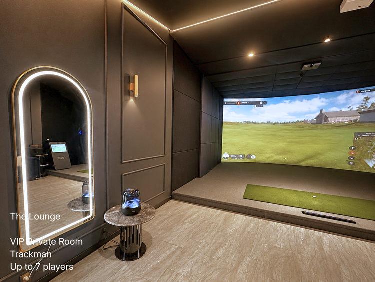 Illuminated arched vanity mirror and fluted acoustic wall panel assembly inside Prime Golf Lounge Richmond