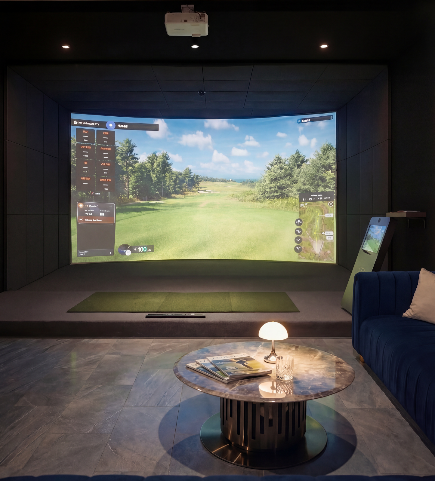 Full-width curved commercial projection impact screen with ceiling-mounted projector and safety enclosure at Prime Golf Lounge