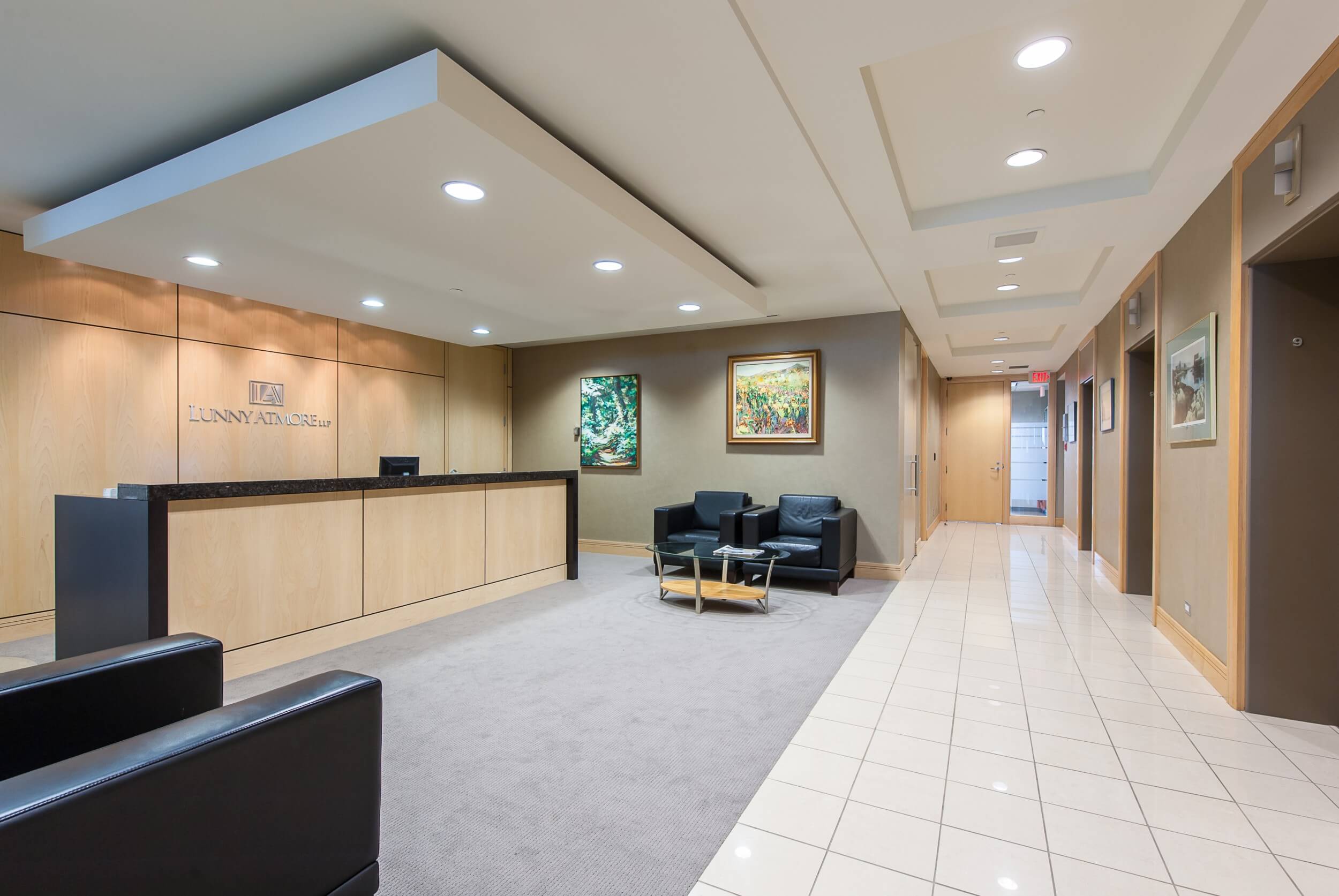 Polished stone elevator vestibule and reception entry inside Downtown Vancouver commercial tower